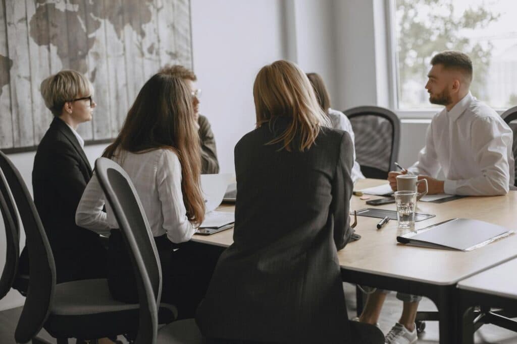 Colleagues in a productive meeting at a modern office, fostering teamwork and collaboration.